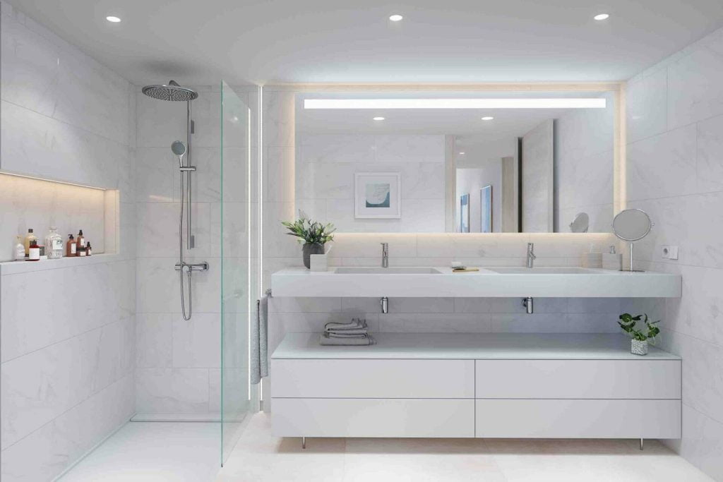ViVi Real Estate: A bright and spacious bathroom in a new development, featuring a large mirror and sink.